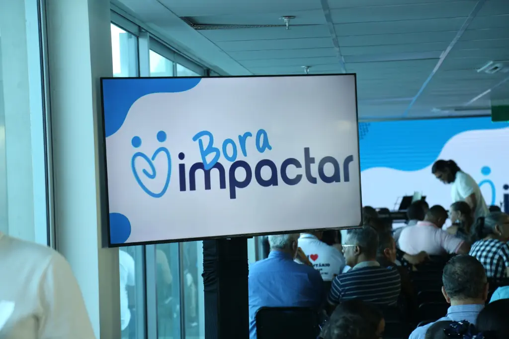 Imagem institucional com as marcas do Instituto Guia Social e do Bora Impactar, plataforma da Prefeitura do Recife. A composição representa a integração do Instituto à plataforma, que conecta e dá visibilidade a iniciativas de impacto social na cidade.