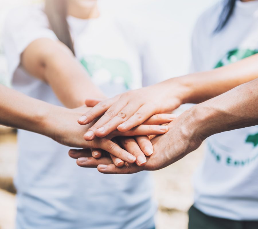 close-up-people-volunteer-teamwork-putting-finger-star-shapehands-togetherstack-handsunity-teamwork-world-environment-day